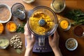 overhead shot of a food processor blending hummus