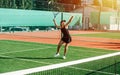 Overhead shot from a girl practicing on a brand new outdoor tennis court Royalty Free Stock Photo