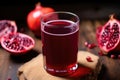 overhead shot of a glass of pomegranate juice