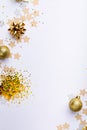 Overhead shot of gold colored decoration over white background, copy space