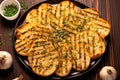 overhead shot of grilled bread with individual cloves of garlic