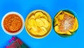 Overhead shot of Honduran Carne con tajadas, meat with plantain chips on a blue surface Royalty Free Stock Photo