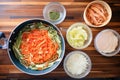 overhead shot of kimchi pancake preparation: batter in bowl, pan ready Royalty Free Stock Photo