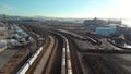 Overhead shot of a line of cargo train cars in the North Vancouver trainyard.