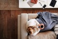 Overhead Shot Looking Down On Woman At Home Lying On Sofa Watching Television Royalty Free Stock Photo