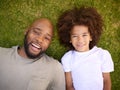 Overhead Shot Of Loving Father And Son Lying On Grass Together Royalty Free Stock Photo