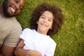 Overhead Shot Of Loving Father And Son Lying On Grass Together Royalty Free Stock Photo