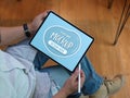 Male worker using mock up tablet on his lap while relaxed sitting on office chair Royalty Free Stock Photo