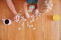 Overhead Shot Of Mother And Daughter Sitting At Table At Home Doing Jigsaw Puzzle Together Royalty Free Stock Photo