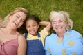 Overhead Shot Of Multi-Generation Female Family Lying On Grass Togther Royalty Free Stock Photo