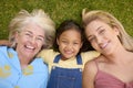 Overhead Shot Of Multi-Generation Female Family Lying On Grass Togther Royalty Free Stock Photo