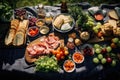 An overhead shot of a picnic blanket spread with delicious food on a sunny meadow Royalty Free Stock Photo