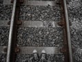 overhead shot of railroad tracks and toe shoes