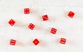 Overhead shot - red craps dices on white board showing different numbers