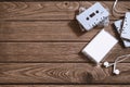 Overhead shot of retro old audio cassette tape with earphone on vintage retro wooden background, flat lay top view with copy space Royalty Free Stock Photo