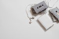 Overhead shot of retro old audio cassette tape with earphone on white background, flat lay top view with copy space Royalty Free Stock Photo