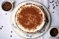 overhead shot of a round tiramisu on a cake stand Royalty Free Stock Photo