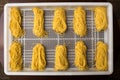 Overhead shot of rows of freshly made spaghetti.