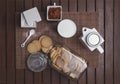 Overhead shot of a rustic wooden table with cookies, sugar, and cinnamon powder