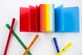 Overhead shot of a set of sketch markers with a colorful notepad with space for your text