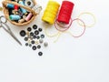 Sewing Supplies Buttons, Thread, Scissors, and Basket on White Background Royalty Free Stock Photo