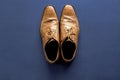 Overhead shot of shoes on a dark blue surface Royalty Free Stock Photo