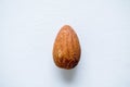Overhead shot of a slated almond on a white surface Royalty Free Stock Photo