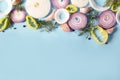 Overhead shot of slices of different vegetables on a blue background