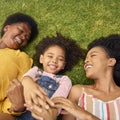 Overhead Shot Of Smiling Multi-Generation Female Family Lying On Grass In Garden Together Royalty Free Stock Photo