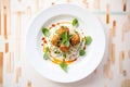 overhead shot of spaghetti and meatballs on white plate, basil garnish Royalty Free Stock Photo