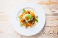 overhead shot of spaghetti and meatballs on white plate, basil garnish Royalty Free Stock Photo