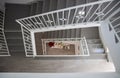 Overhead shot of a staircase with white handrail