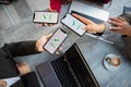 Overhead shot of three businesswomen paying bill at a bar with smart phones with Payment completed text