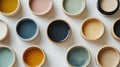 Pastel Paint Colors in Small Containers on White Background AI-generated. Royalty Free Stock Photo
