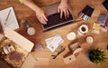 Overhead Shot Of Woman Running Online Business Making Boutique Candles At Home Working On Laptop Royalty Free Stock Photo