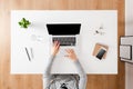 Overhead shot of woman working on laptop Royalty Free Stock Photo