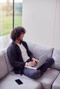 Overhead Shot Of Young Man At Home Sitting On Sofa Using Laptop Computer Royalty Free Stock Photo