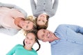 Overhead of smiling family lying together in a circle