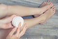 Overhead top above close up view photo of pretty beautiful lady applying cream from jar on jegs. Sugaring shaving removing unneces