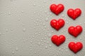 Overhead top above close up view photo of valentine day red hearts on grey backdrop with drops Royalty Free Stock Photo