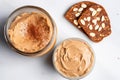 overhead view of almond butter jar and two slices of toasted bread Royalty Free Stock Photo