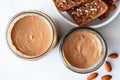 overhead view of almond butter jar and two slices of toasted bread Royalty Free Stock Photo