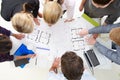 Overhead View Of Architects Discussing Plans In Office Royalty Free Stock Photo