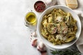 Overhead view of artichoke pasta with parmesan and olive oil in a white ceramic bowl Royalty Free Stock Photo