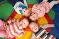 Overhead View Of Babies Lying On Mat At Playgroup Royalty Free Stock Photo