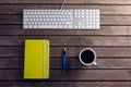 Black coffee, pen, organizer and keyboard on wooden table Royalty Free Stock Photo