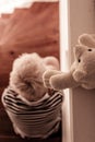 Overhead view of blond child seated on stairs Royalty Free Stock Photo