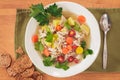 Overhead view of a bowl of homemade chicken and white bean soup