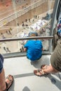 Overhead view boy looking down beach Brighton Tower. England