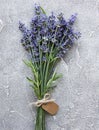 Overhead view of a bundle of fresh lavender flowers with blank tag